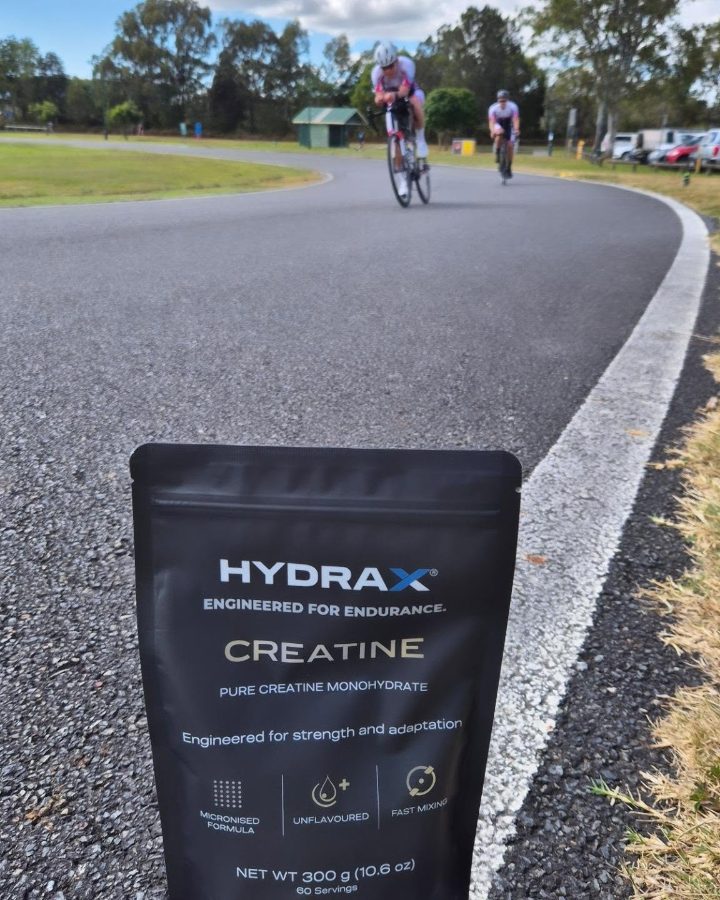 HYDRAX CREATINE pouch trackside with riders on a time trial course